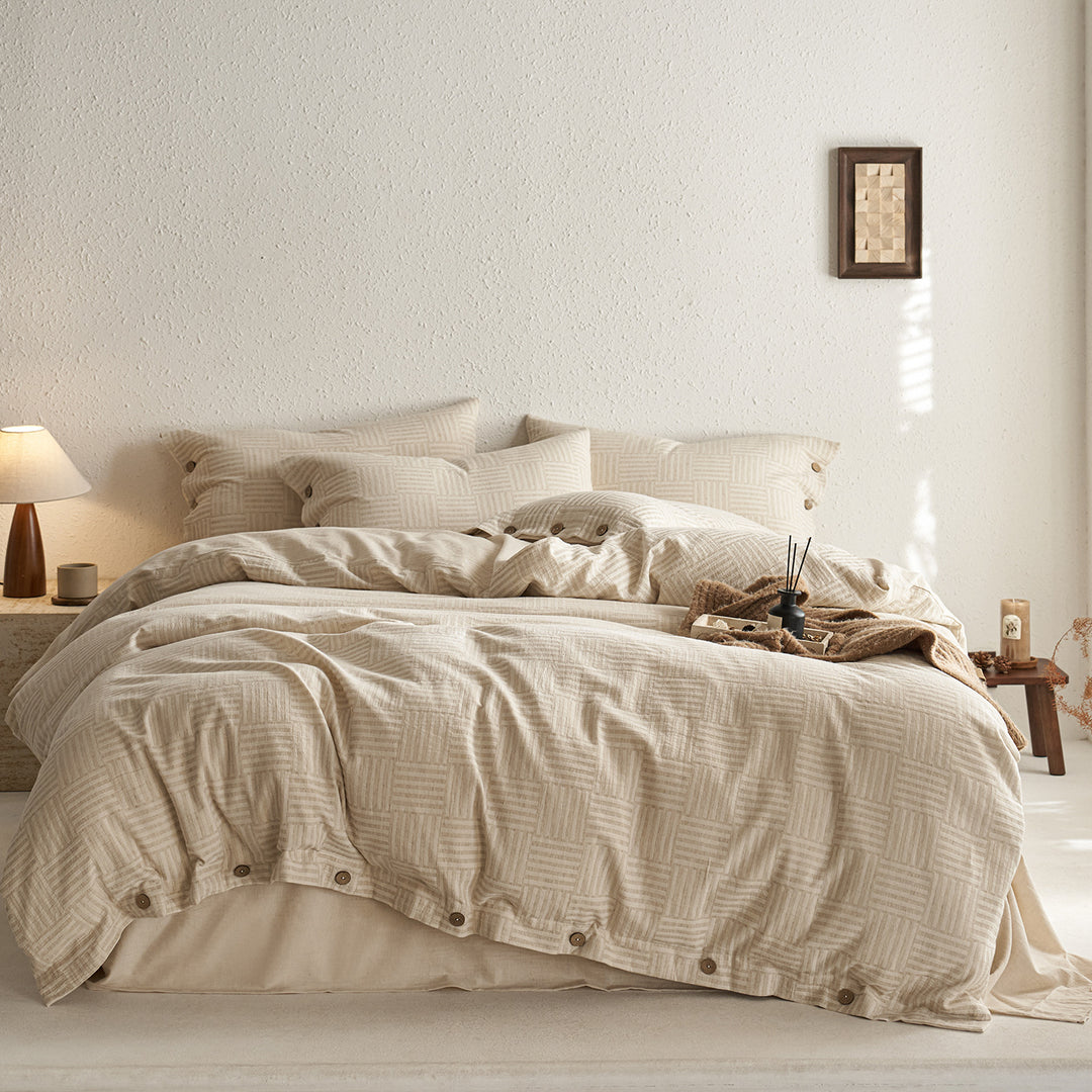 Reversible cotton bedding set with button closure and subtle geometric jacquard
