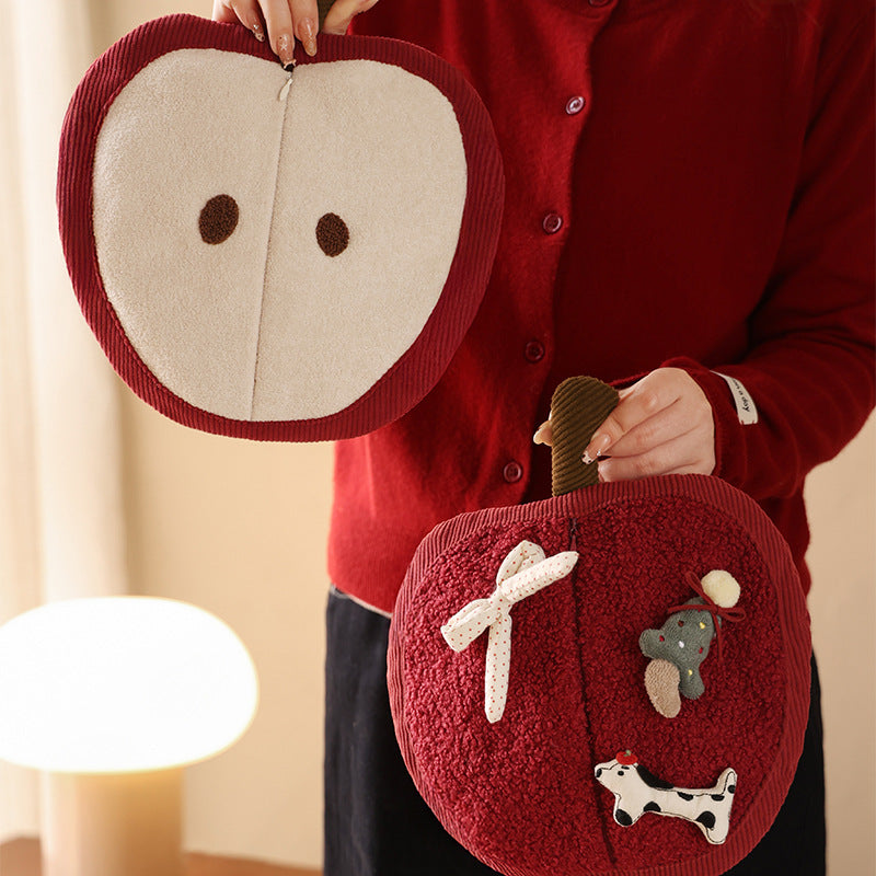 Wall-mounted handkerchief bag in apple shape with handle, plush applications and opening for tissues