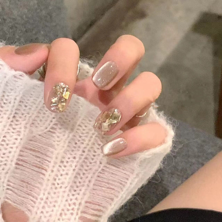 Acrylic nail set with glamorous gold details Kalsten