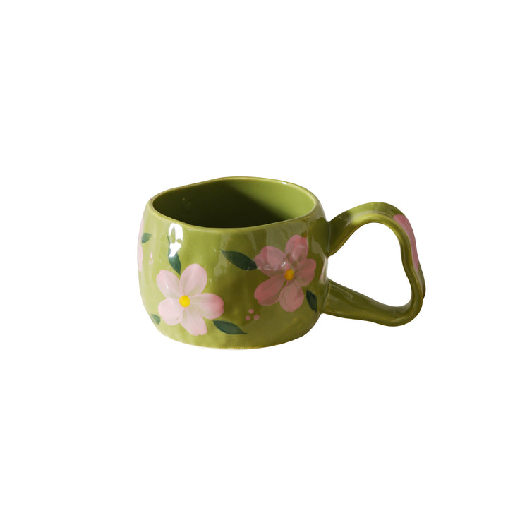 Ceramic mug with hand-painted stripes and flower design