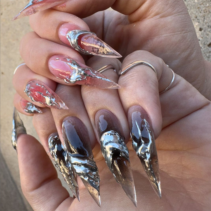 Creative stiletto nails with unique metallic details Kalsten