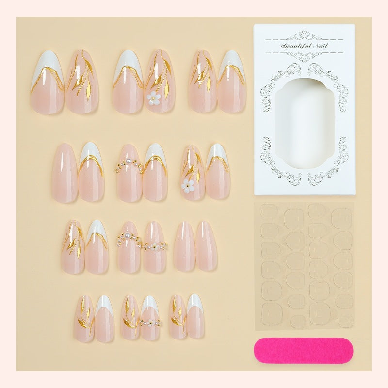Artificial nail set with elegant gold accents and floral designs Kalsten
