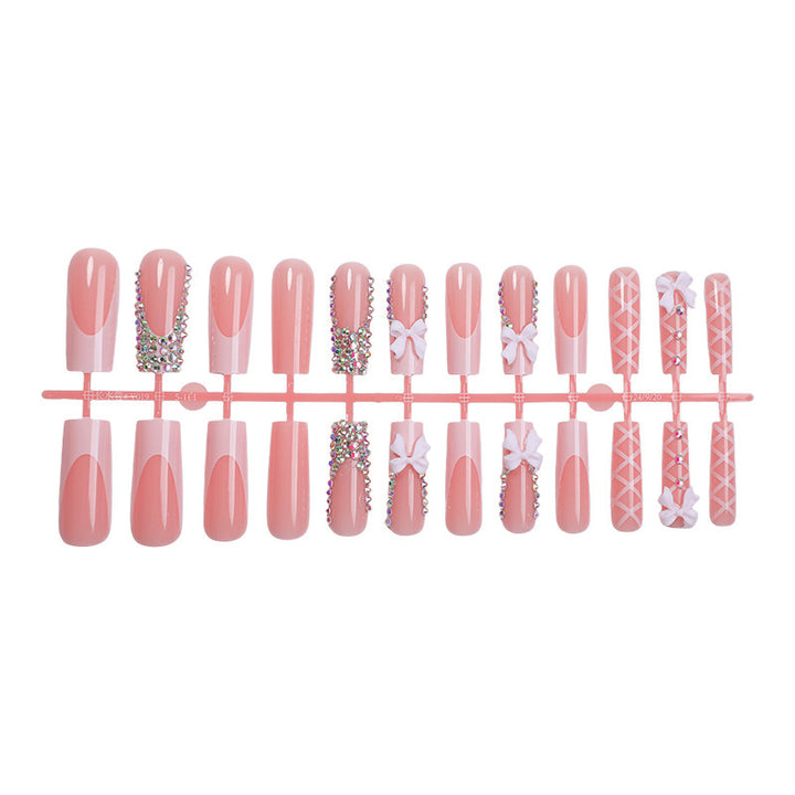 Artificial nail set with elegant bow and glitter accents Kalsten
