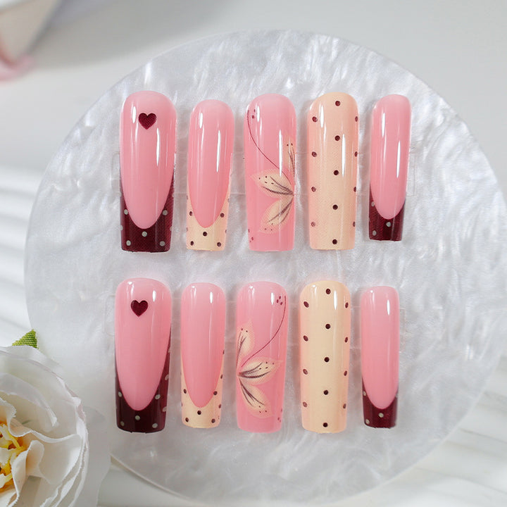 Acrylic nail set with elegant floral and polka dots design Kalsten
