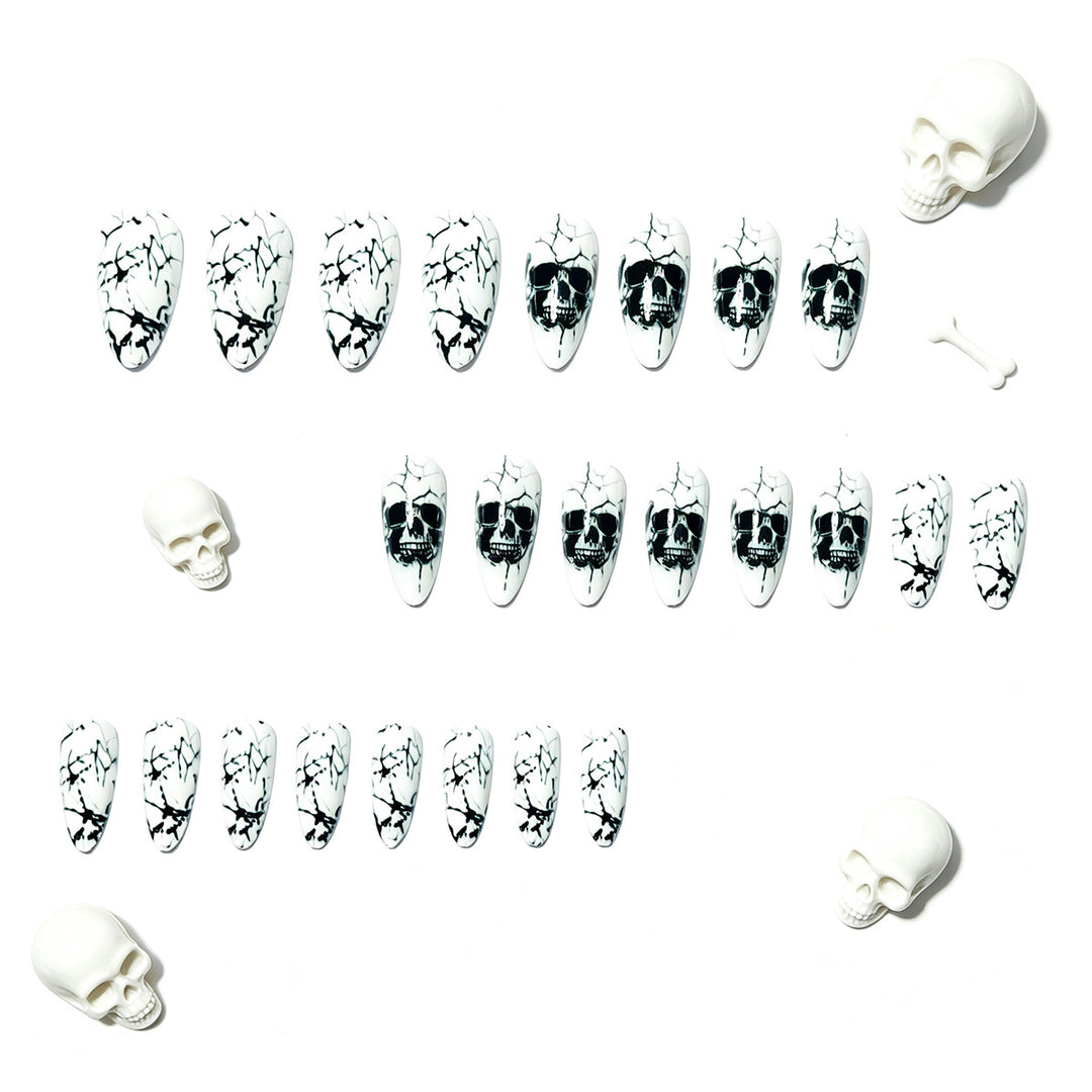 Artificial nails with playful skull design and crackle effects Kalsten
