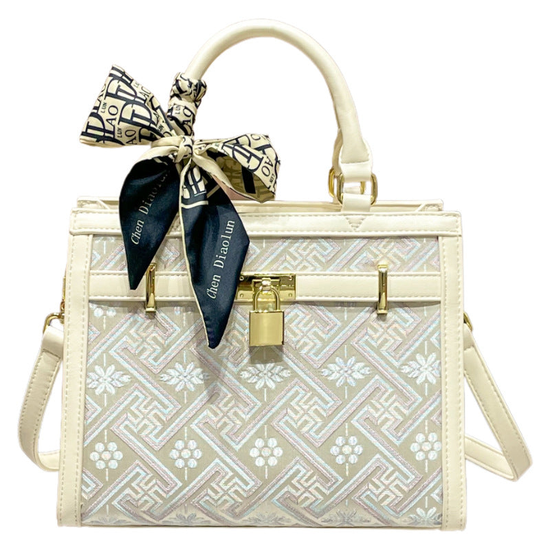 Elegant Designer Handbag with Decorative Bow