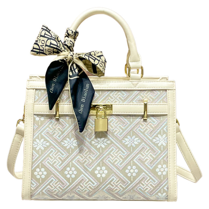 Elegant Designer Handbag with Decorative Bow