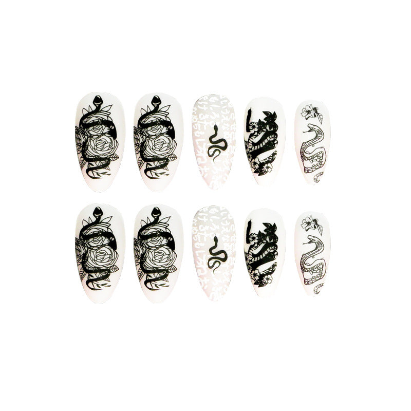 Artful nail extensions in elegant stiletto style with artistic floral and graphic designs Kalsten