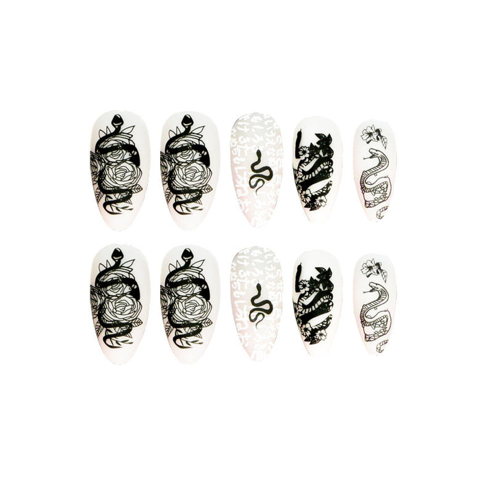 Artful nail extensions in elegant stiletto style with artistic floral and graphic designs Kalsten