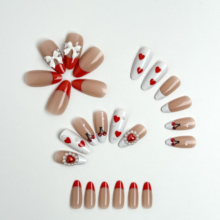 Creative nail art with heart and cherry motifs Kalsten