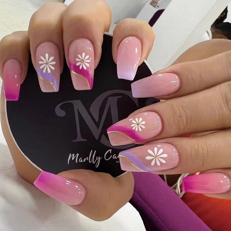 Artful nail extensions with colorful ombre design and floral accents Kalsten