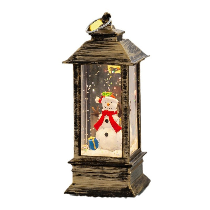 Christmas lantern with LED lighting and decorative snow effect