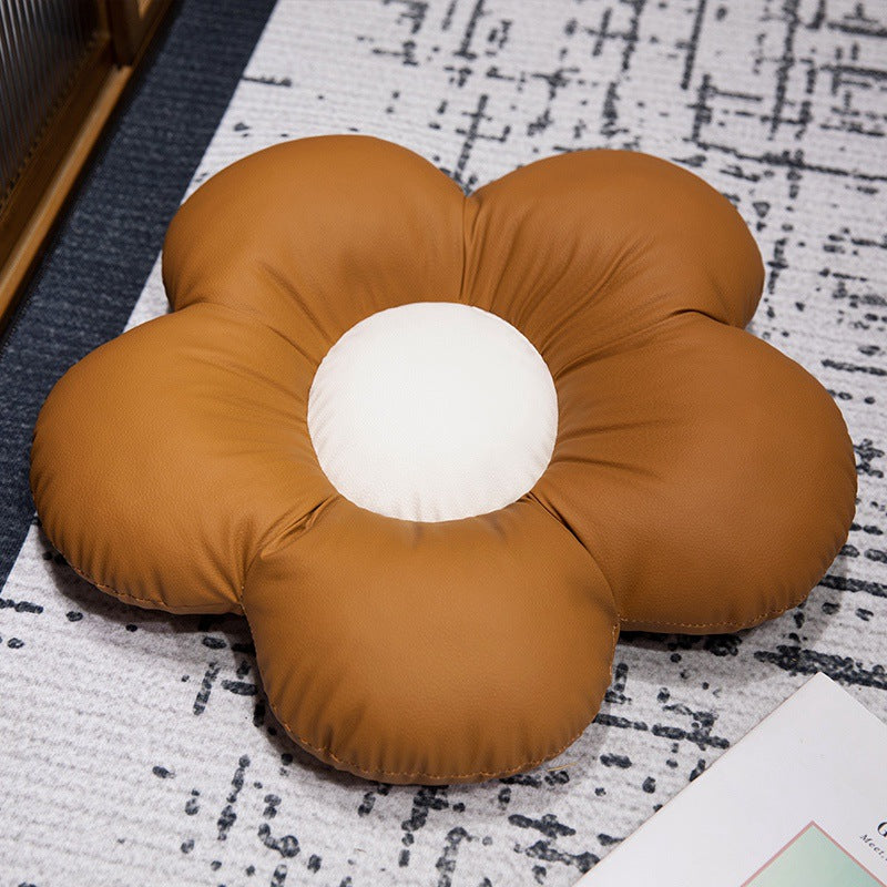 Padded seat cushion in flower shape with faux leather center piece and fluffy edge padding