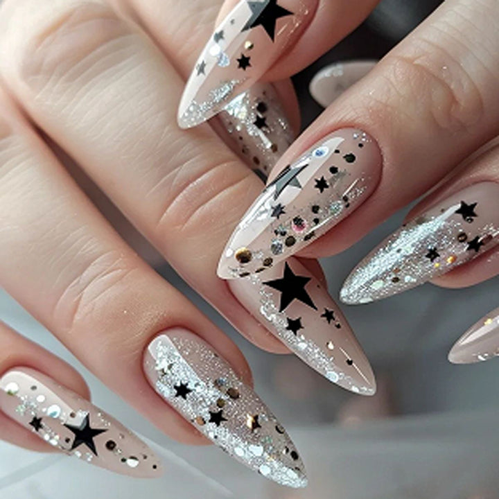 Artistic stiletto nails with glitter and star design Kalsten