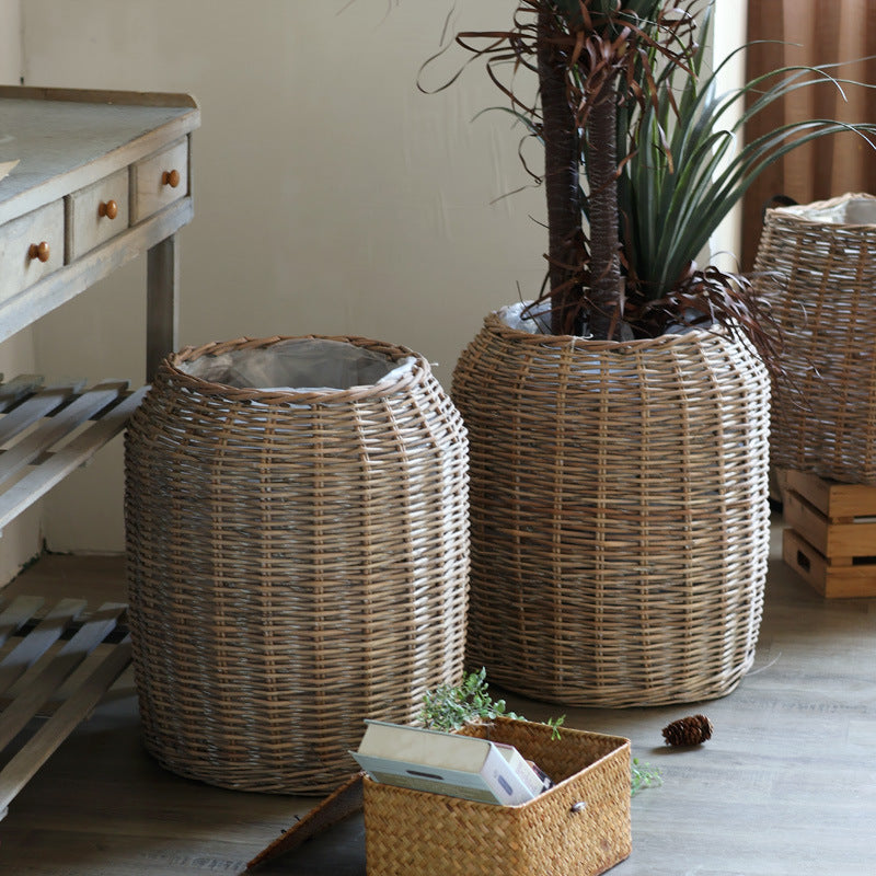 Stylish laundry basket made of braided natural material Kalsten