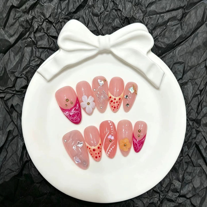 Artistic Press-On Nail Set with Floral and Decorative Elements