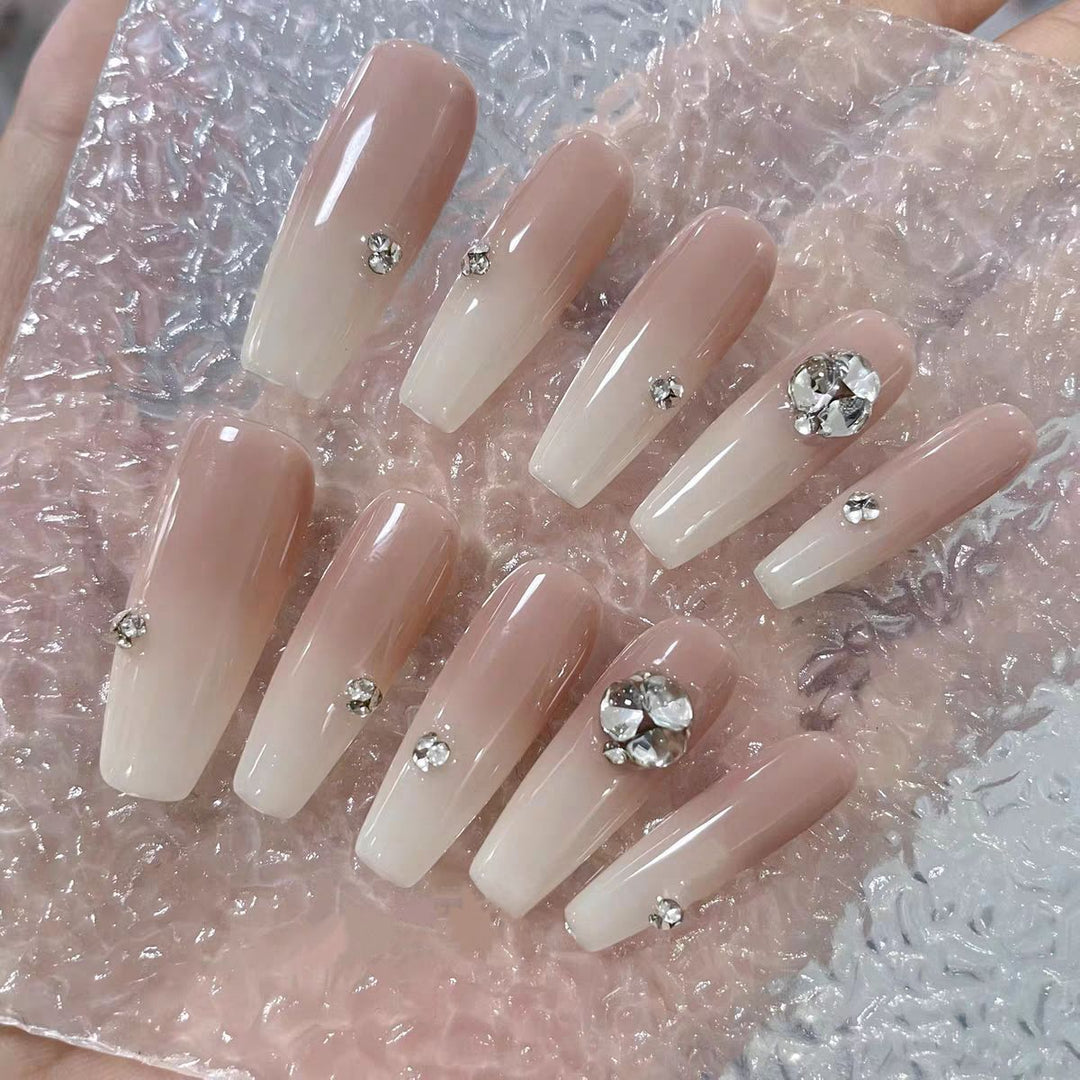Elegant Acrylic Nail Extensions with Rhinestone Accents