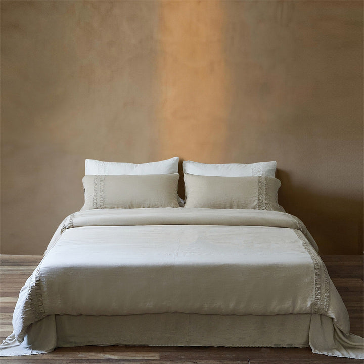 Linen bedding set with stonewash finish and delicate ruffle inserts