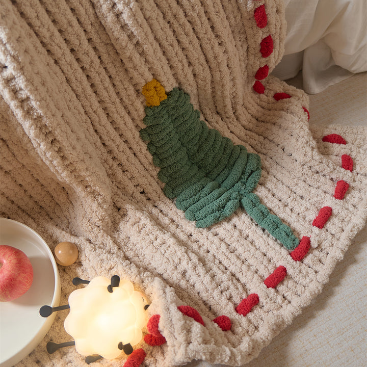 Cozy daybed cover with relief teddy structure, fir motif, and contrasting decorative seam