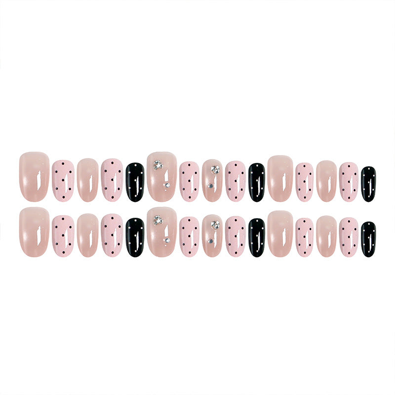 Acrylic nail set with glamorous rhinestone accents and modern dots Kalsten