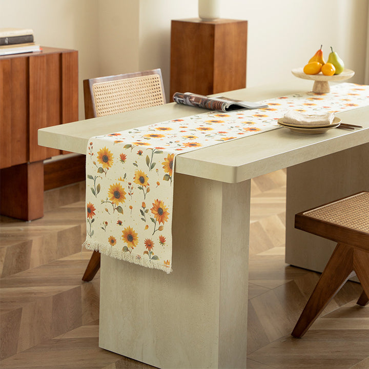 Woven table runner with floral embroidery and fringe trim