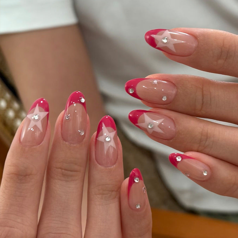 Elegant Press-On Nail Design with Star and Rhinestone Accents Kalsten