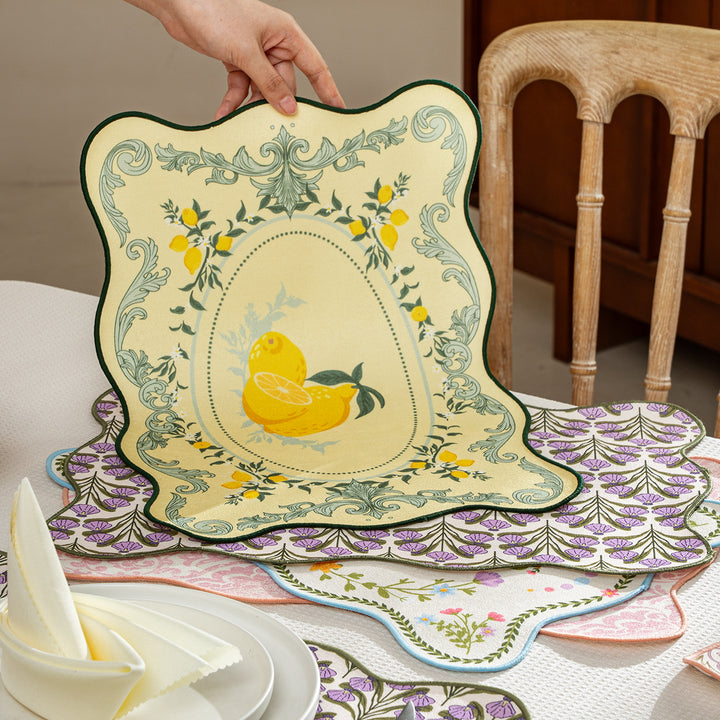 Shaped placemat made of cotton blend with pomegranate and parrot motif