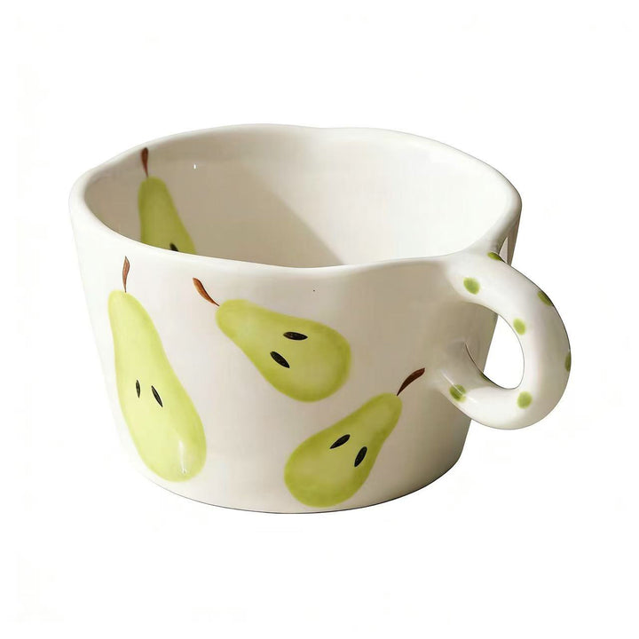 Ceramic mug with hand-painted banana illustration and round handle