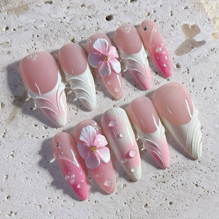 Artificial nail set with delicate floral and glitter accents Kalsten