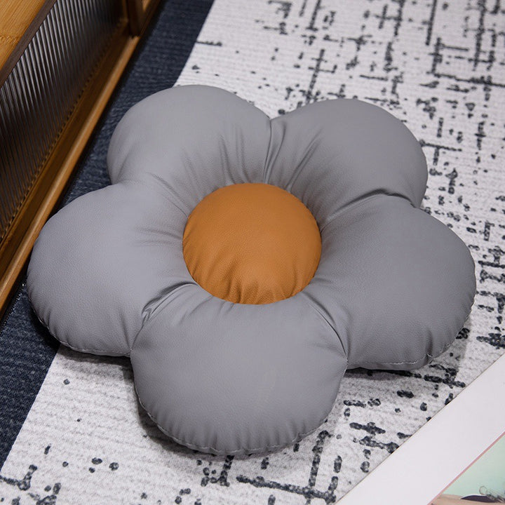 Padded seat cushion in flower shape with faux leather center piece and fluffy edge padding