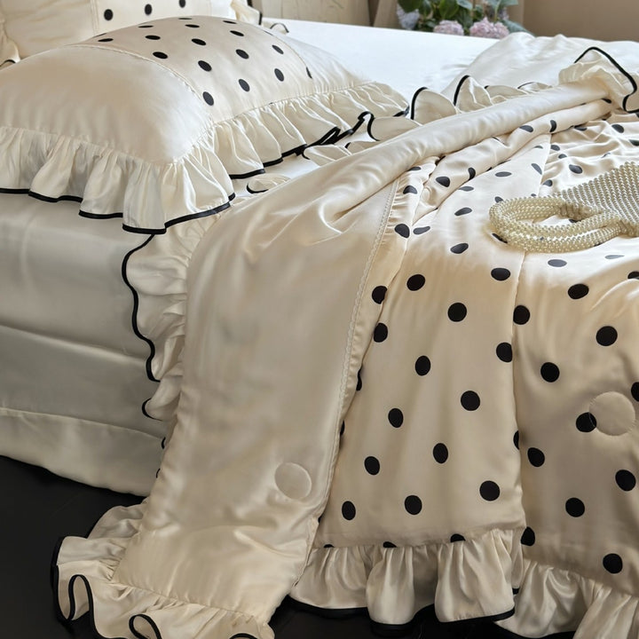 Elegant satin bedding set with polka dot pattern, ruffle and contrasting edge piping