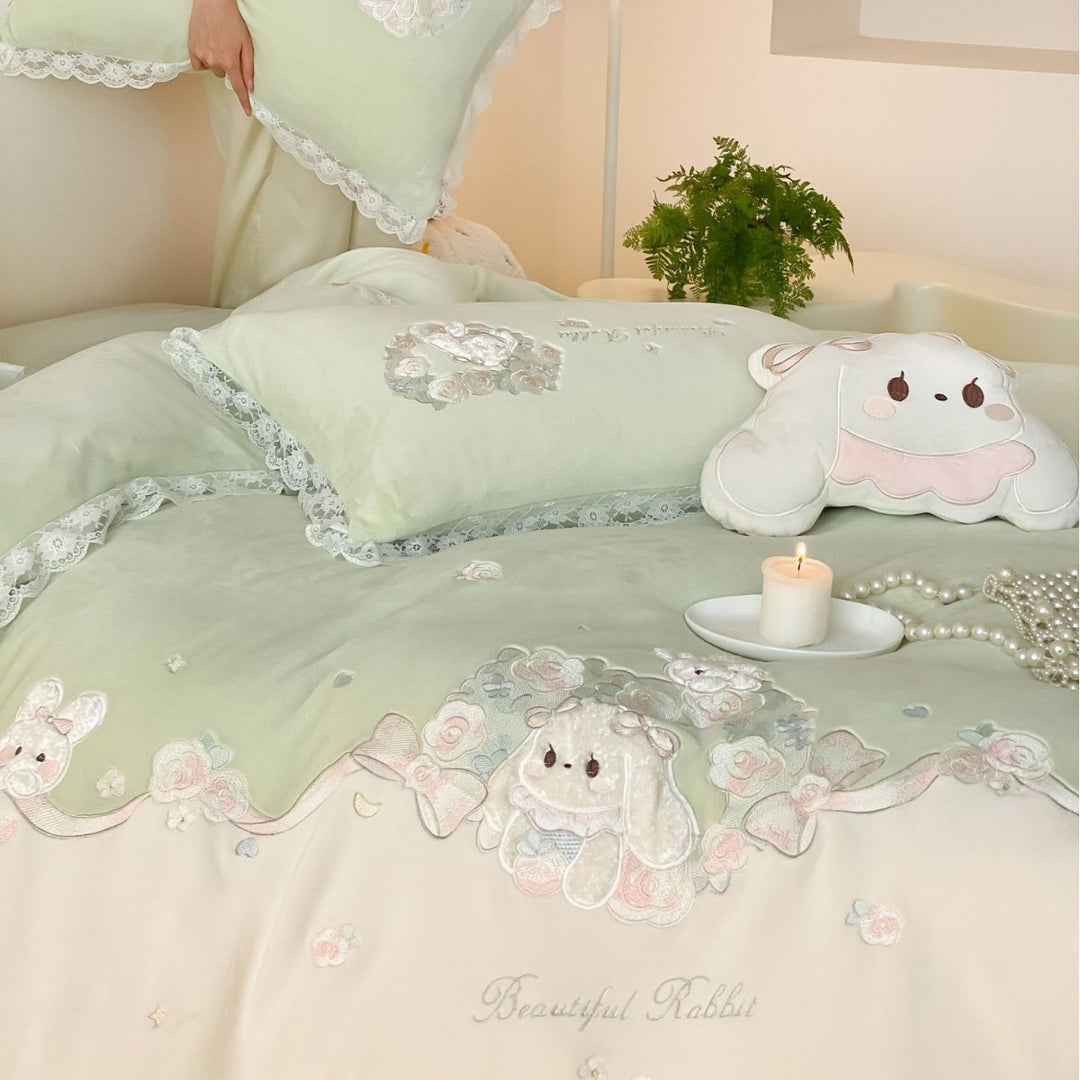 Romantic children's bedding set with embroidered bunny appliqués and lace ruffle