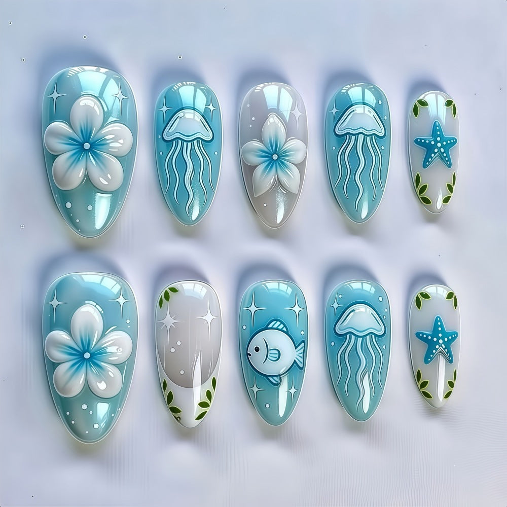 Artificial nails in a maritime design with colorful shell and water motifs Kalsten