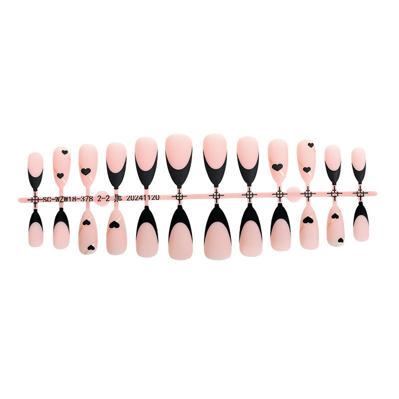Creative nail art set with heart-shaped accents and elegant French tips Kalsten