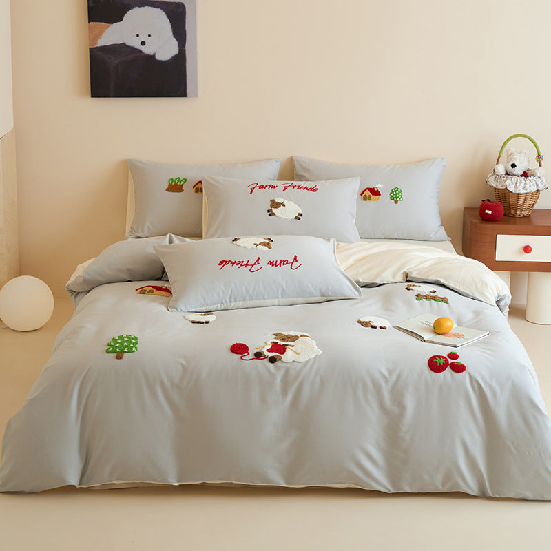 Cotton bedding set with embroidered cat appliqués and reversible pillowcases