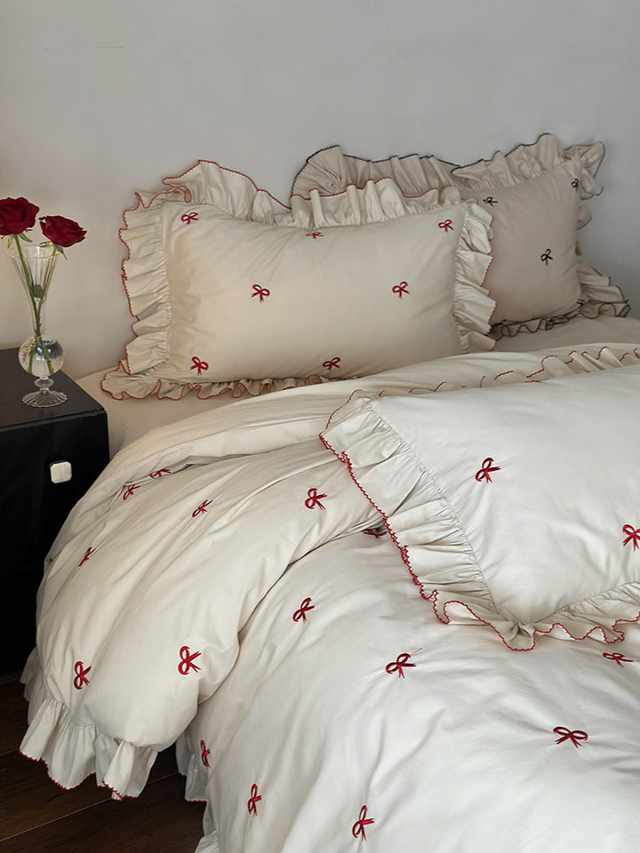 Luxurious bed linen set with ruffles and embroidered bows