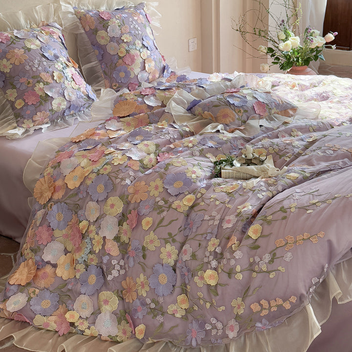 Embroidered bedding set with 3D flower application and ruffle hem