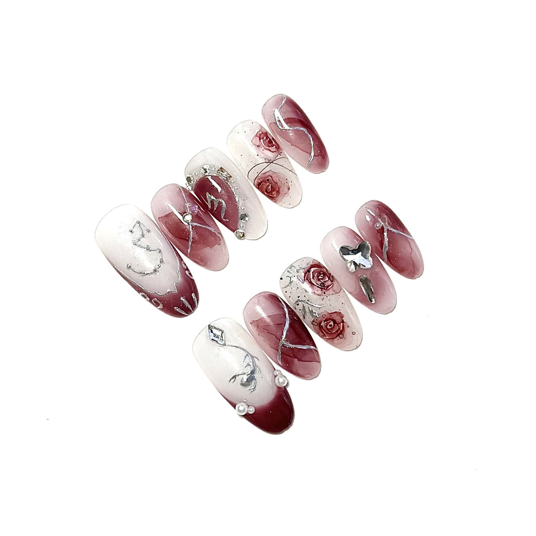 Artistic Press-On Nail Set with Floral Designs and Gem Accents