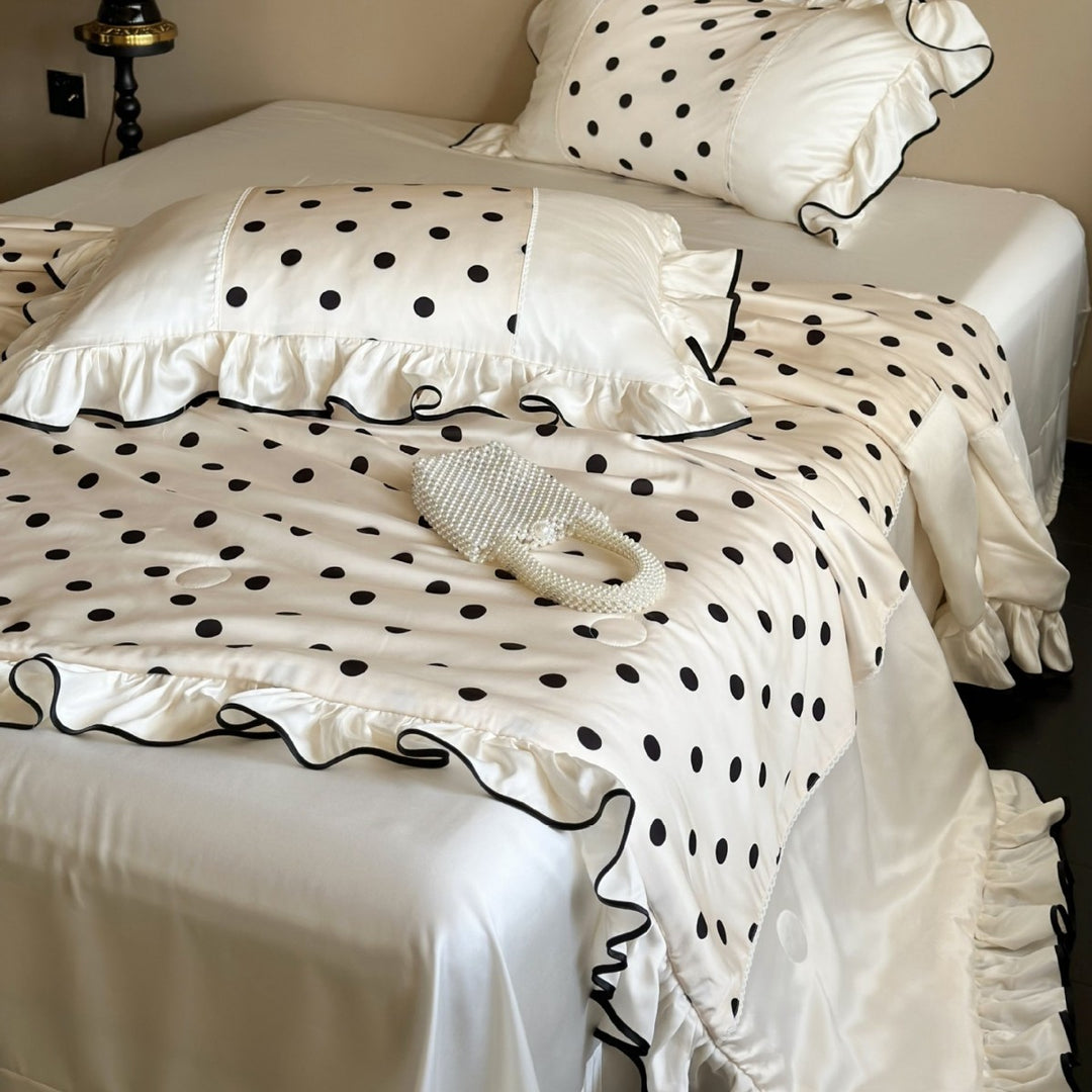 Elegant satin bedding set with polka dot pattern, ruffle and contrasting edge piping