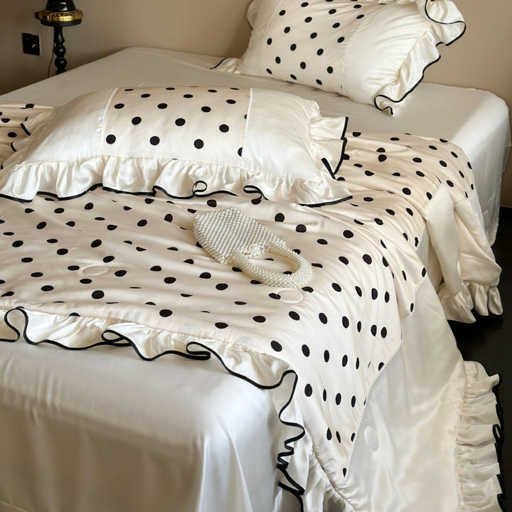 Elegant satin bedding set with polka dot pattern, ruffle and contrasting edge piping