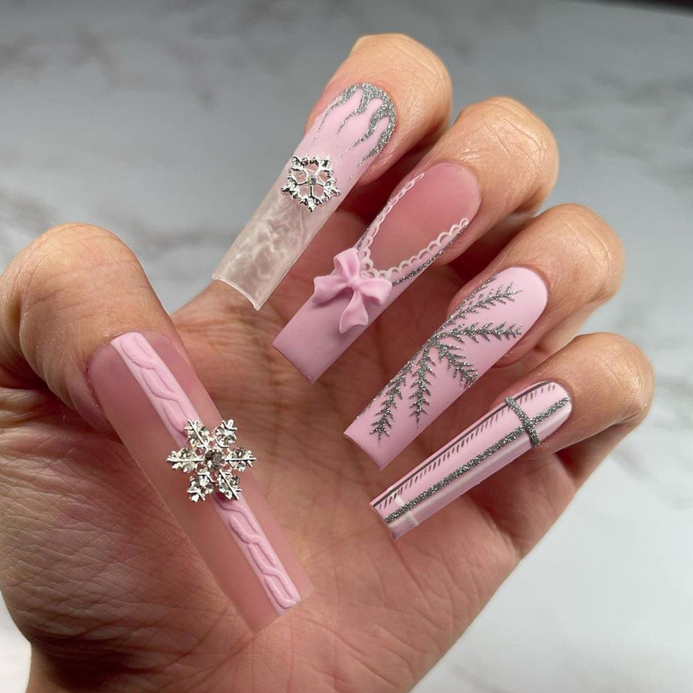 Artful nail extensions with festive decorations Kalsten