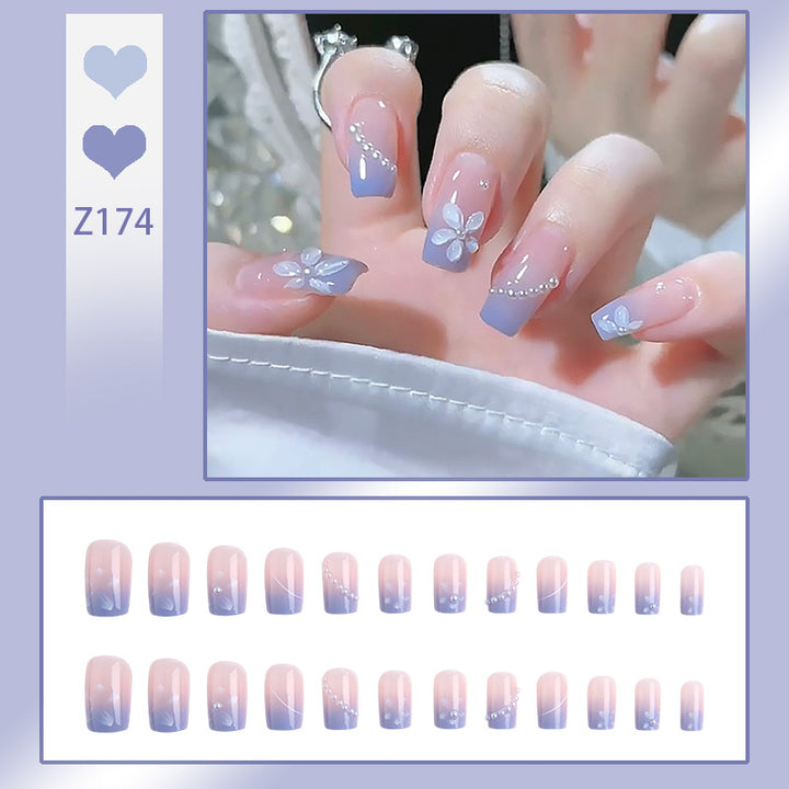 Nail set with elegant floral accents and glitter embellishments Kalsten