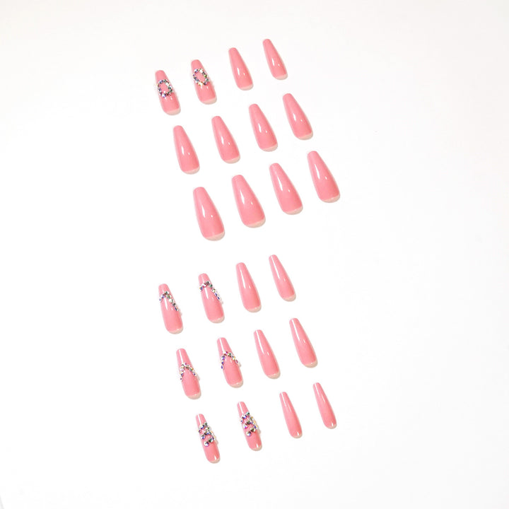 Artificial nail extensions with elegant rhinestone embellishments Kalsten