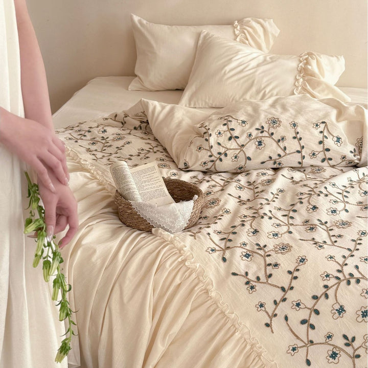 Bedding set with floral embroidered cover, gathered ruffle and cotton texture