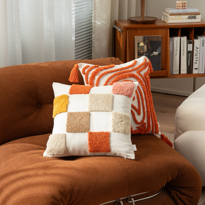 Decorative pillow with textured square appliqués and cotton cover