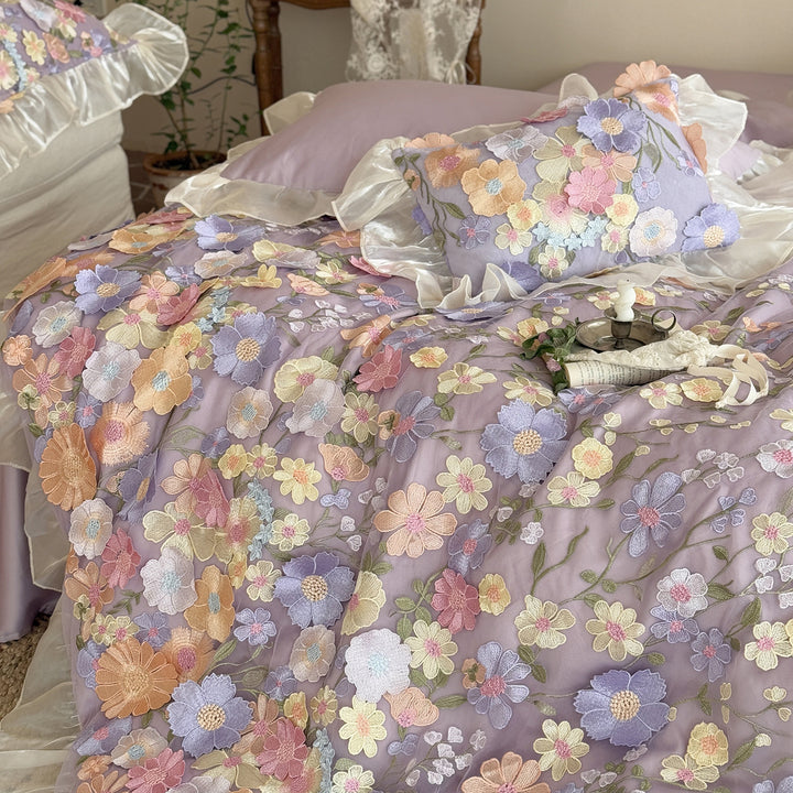 Embroidered bedding set with 3D flower application and ruffle hem