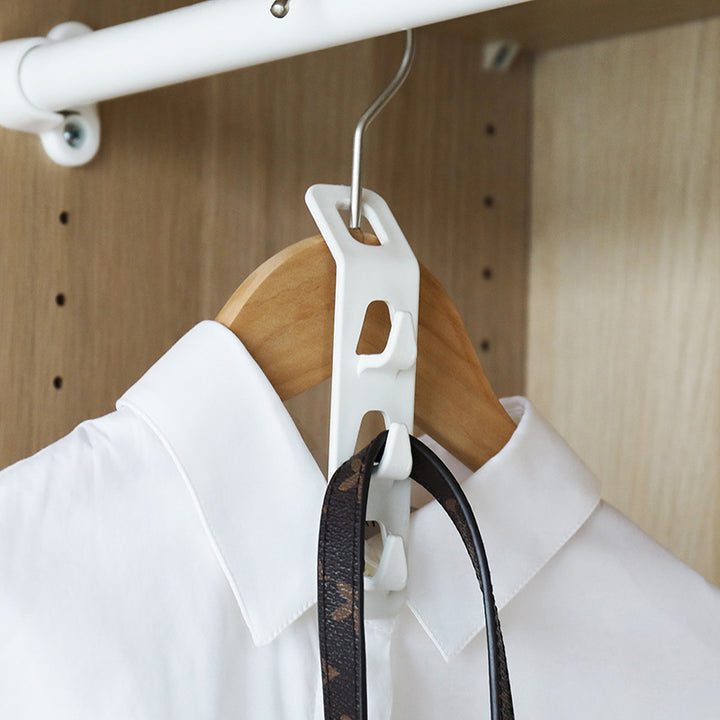 Clothes hanger connector clips made of sturdy plastic for space-saving storage