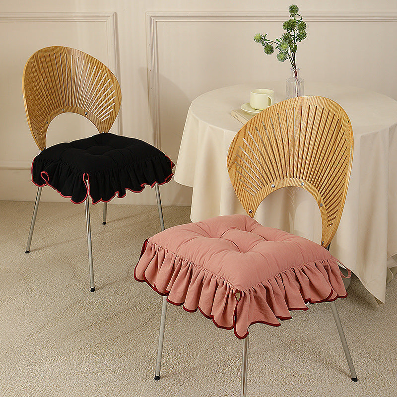 Padded chair cushion with ruffle and fastening bands