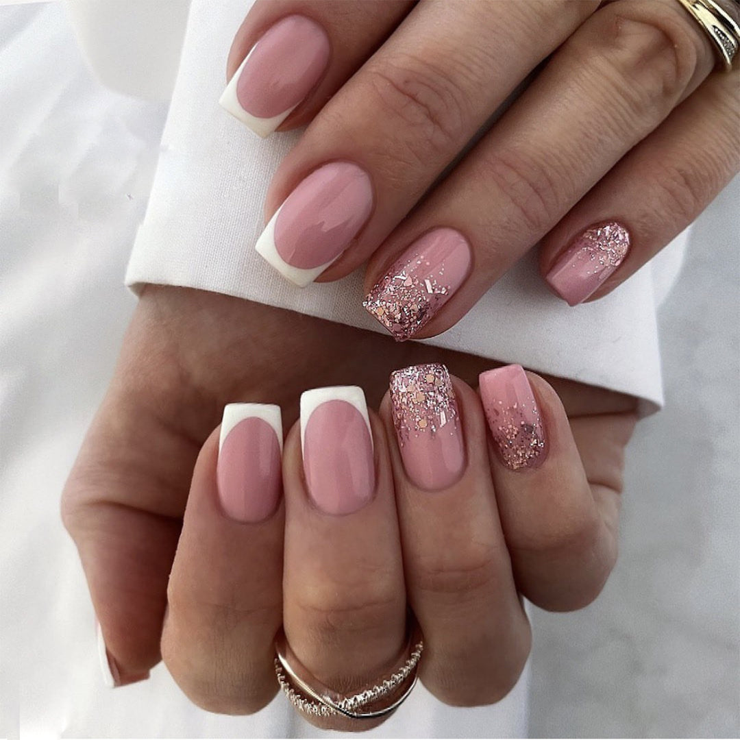 Artful Nail Art with Elegant Glitter and French Tip Accents Kalsten