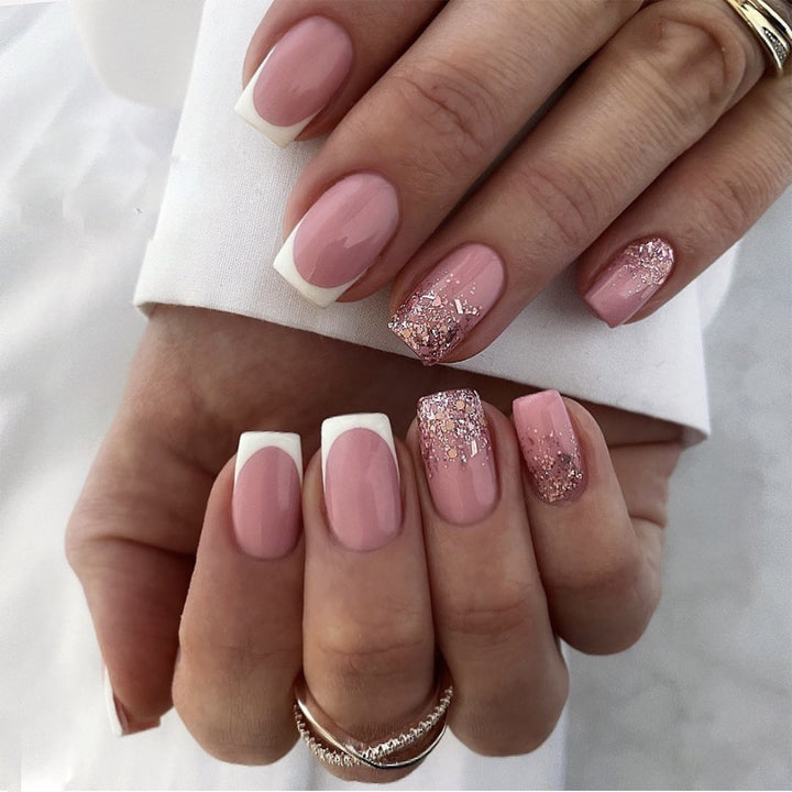 Artful Nail Art with Elegant Glitter and French Tip Accents Kalsten